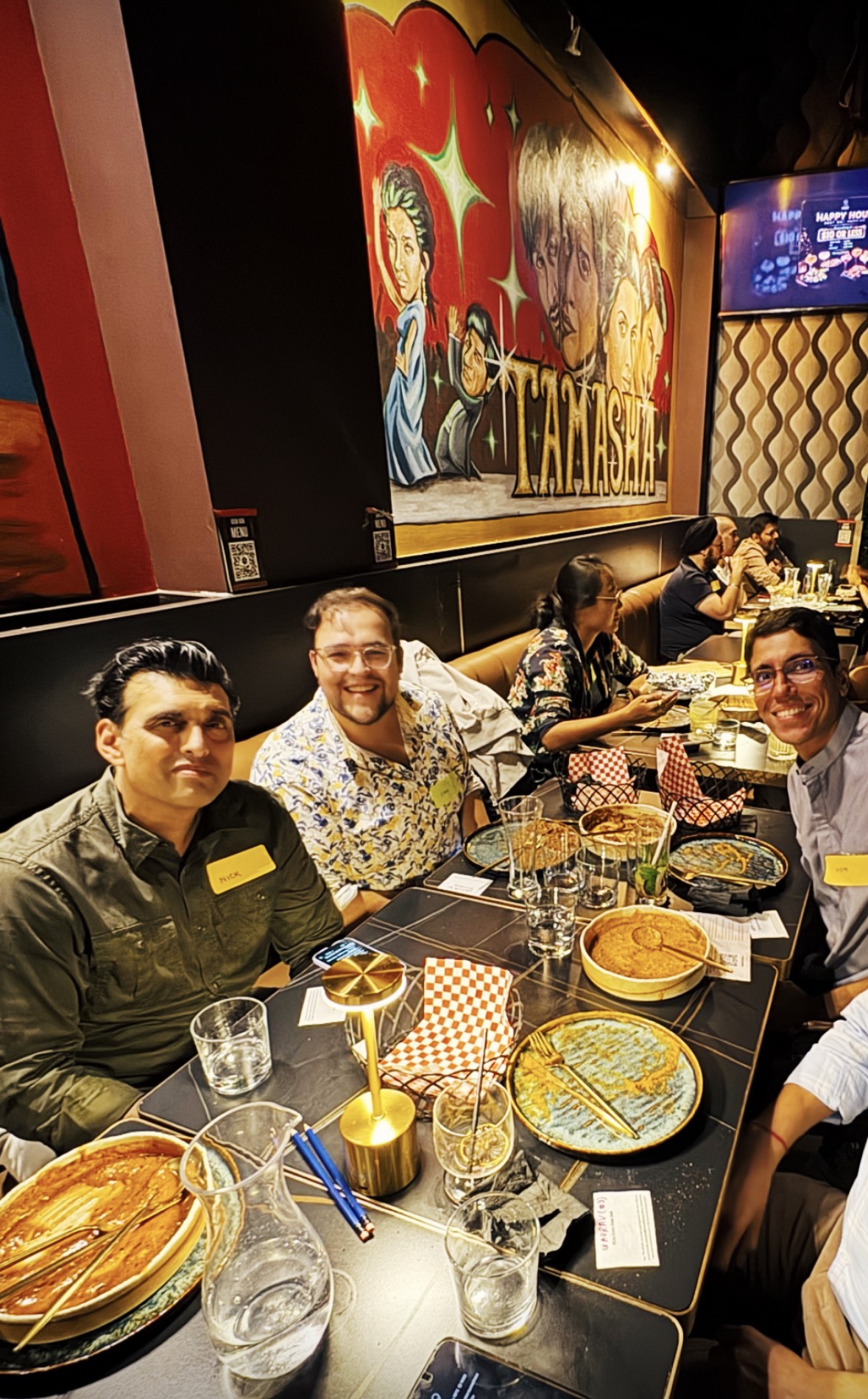 Founders smiling around a LocoBloco dinner table
